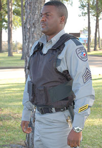 Man wearing a black protective vest
